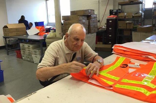 Elderly man working on MTA vest